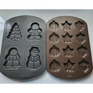 Two Holiday Wilton Cookie Pans Molds one is Fall theme and one is Winter